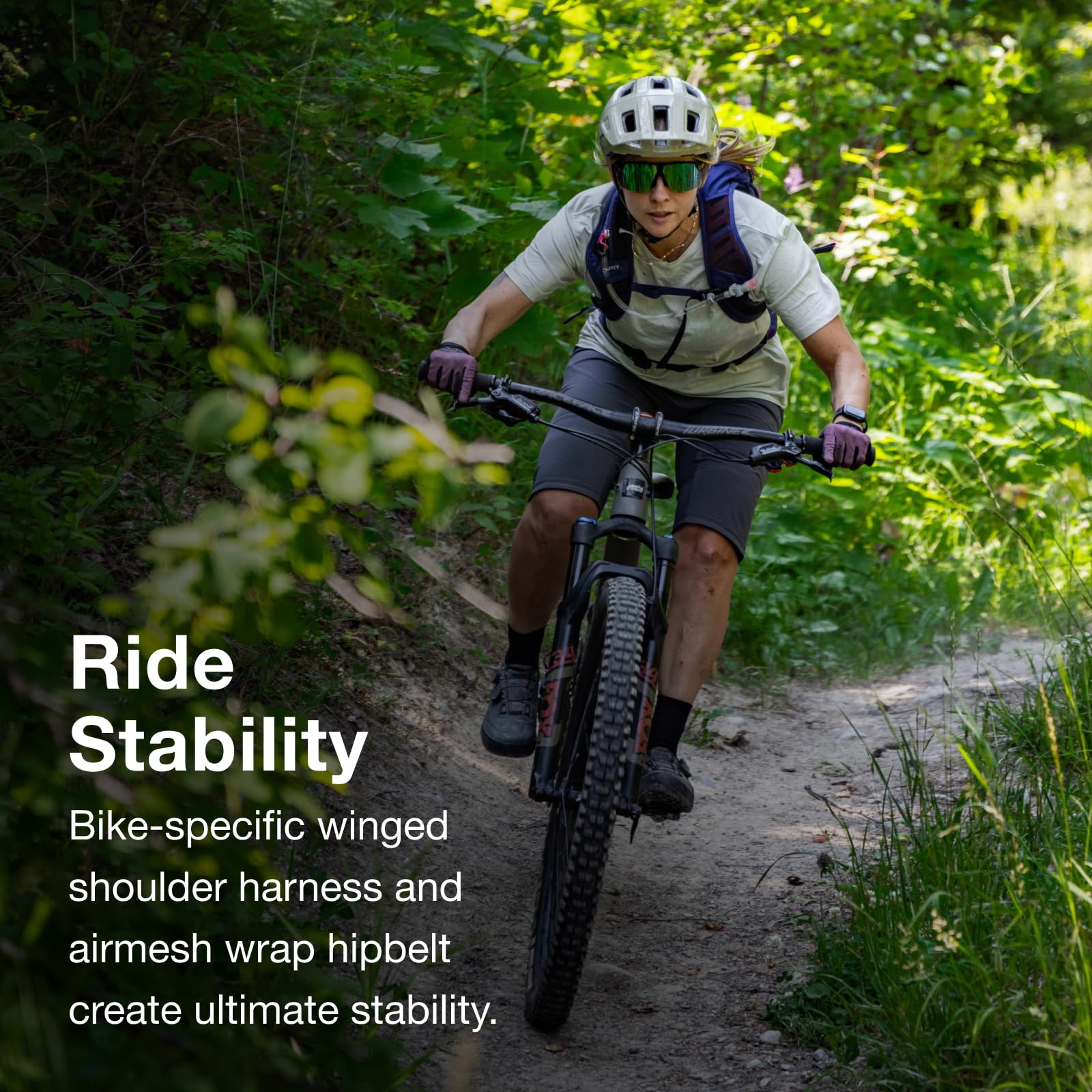 Winged harness enhances stability on rough MTB trails.
