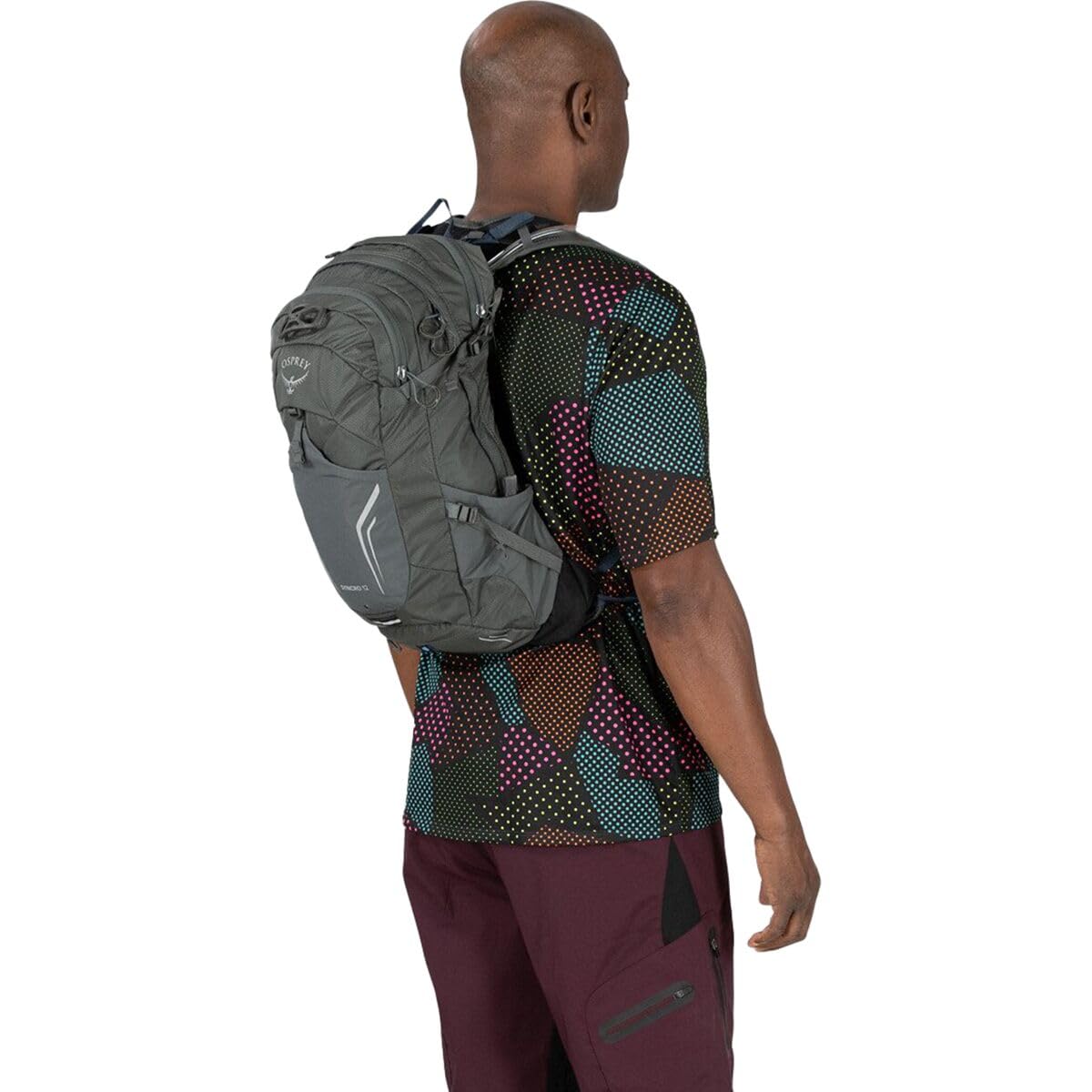 Osprey Syncro 12L raincover stowed in base pocket of the pack