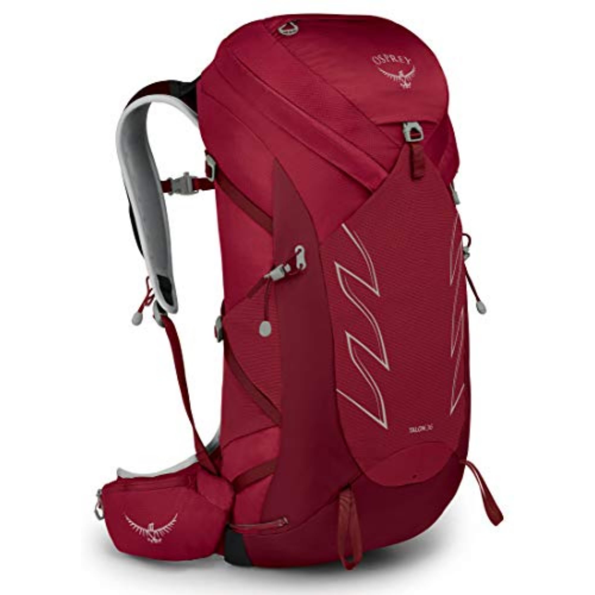 Osprey Talon 36L backpack with cosmic red hipbelt, stabilizing load on rugged trails.