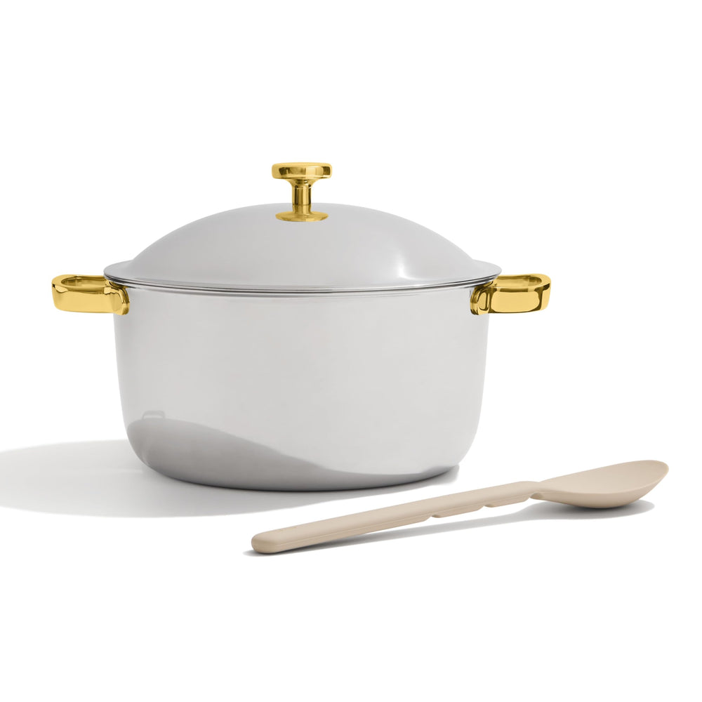 Our Place Titanium Perfect Pot Pro on stove shows 6.75 qt capacity for simmering and braising.