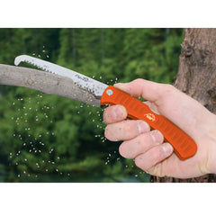 Outdoor Edge Flip N Zip Saw with Mossy Oak sheath ready for rugged field use