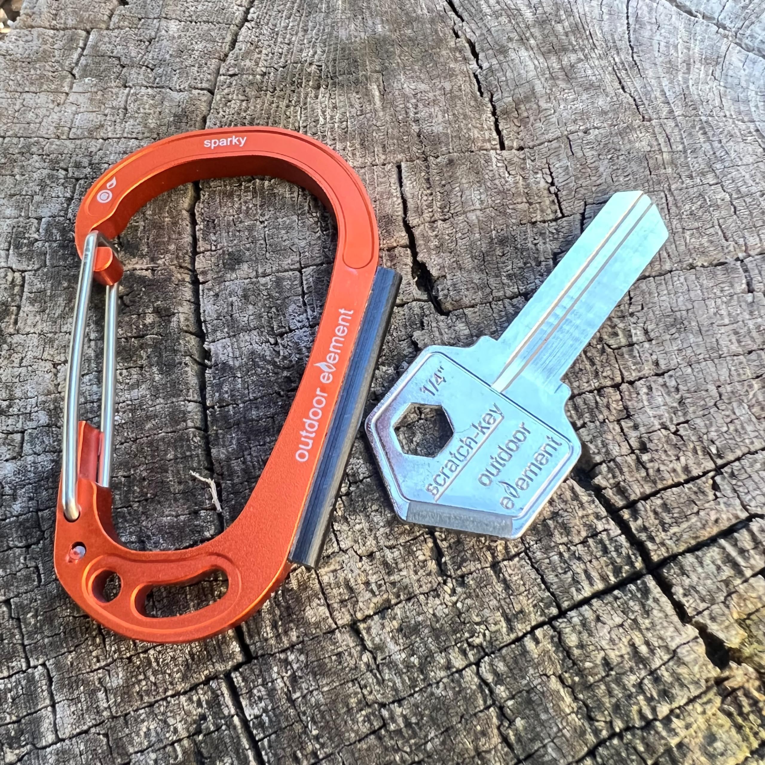 Outdoor Element Sparky Scratch Key in orange KW1 highlights easy visibility and versatility.