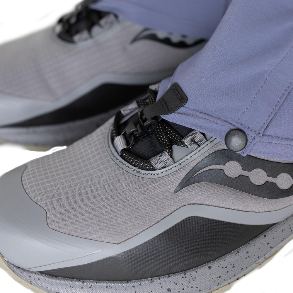 Outdoor Research Ferrosi Trail Gaiters in-use on a trail demonstrating water and wind resistance.