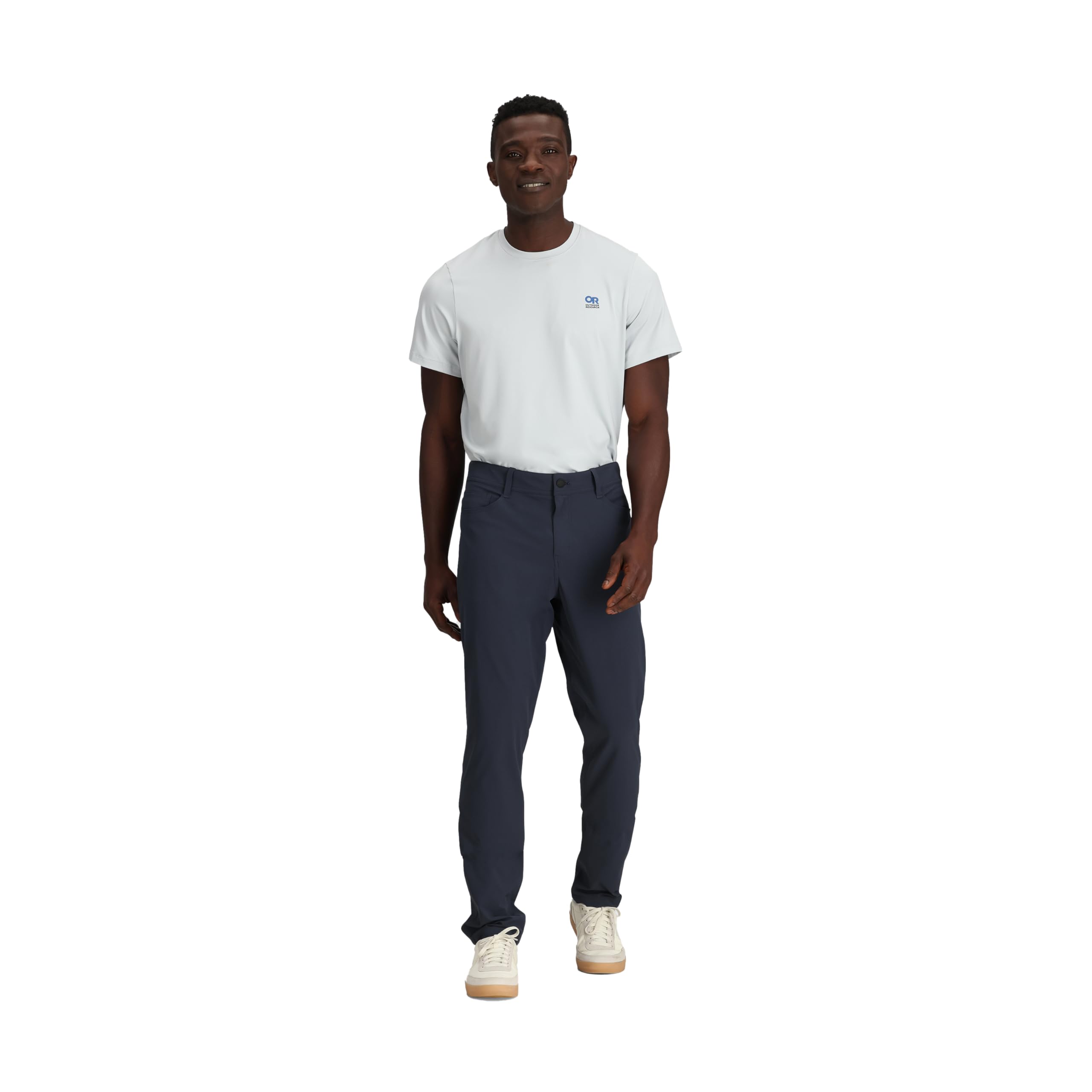 Outdoor Research Ferrosi Transit Pants in motion on a rocky path for versatile outdoor use.