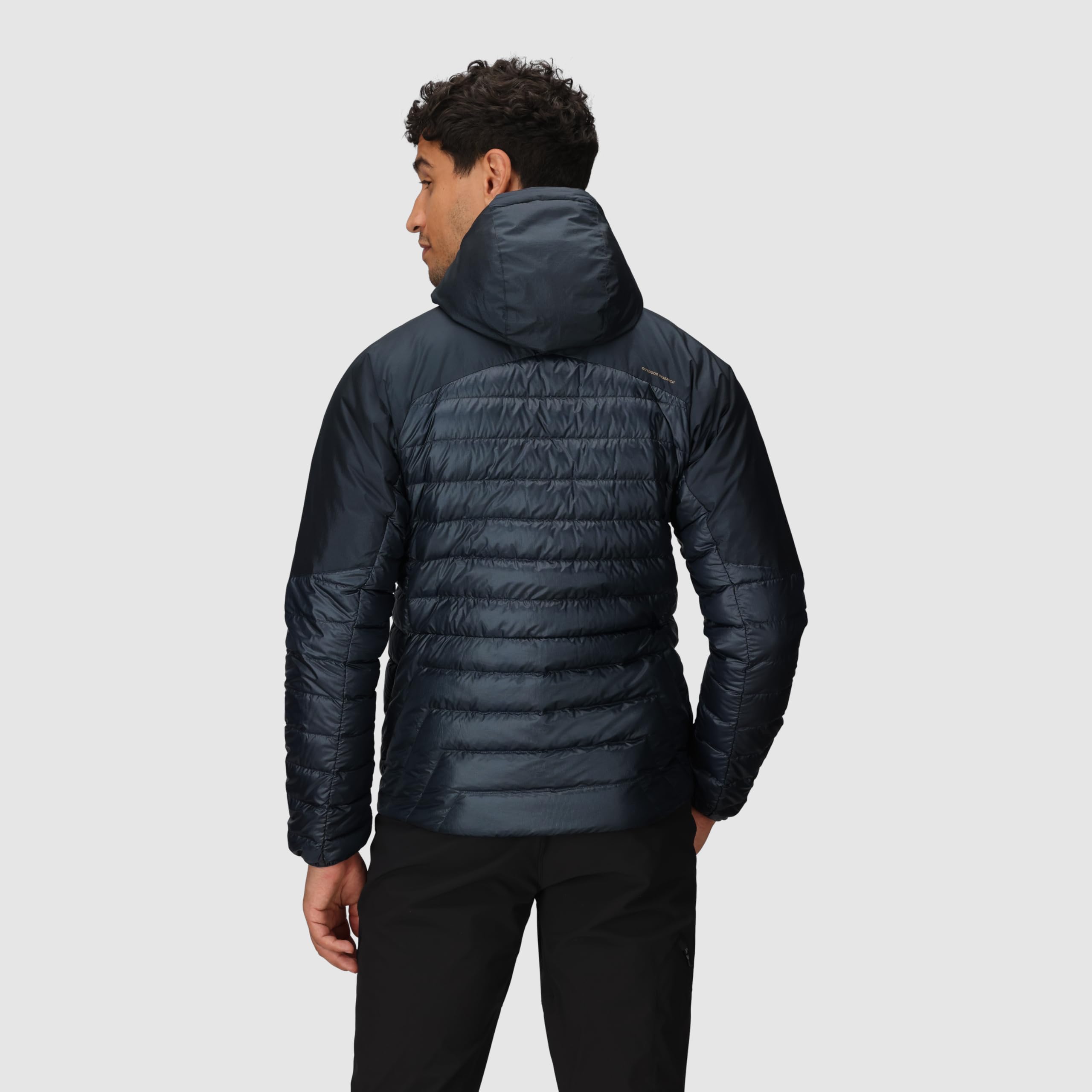 Outdoor Research Helium Down Hoodie Atlantic interior pocket glimpse demonstrates secure storage