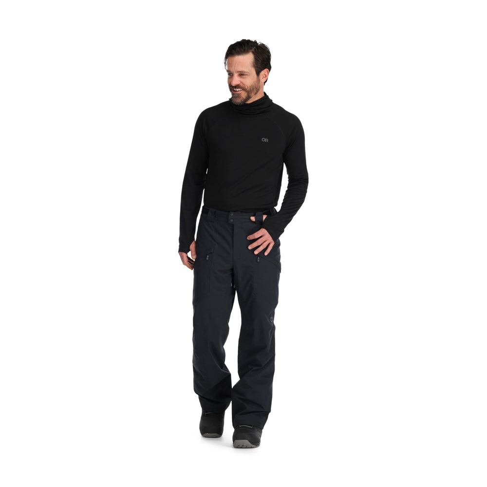 Outdoor Research Snowcrew Pants lifestyle shot suggests easy layering with outerwear