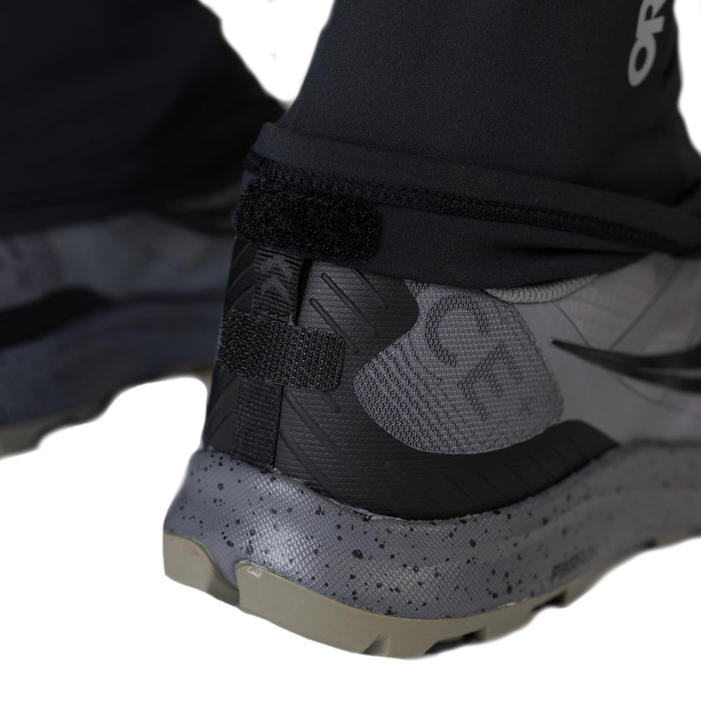 Outdoor Research Swift Run Gaiters on rugged terrain show breathable fabric and UPF sun protection.