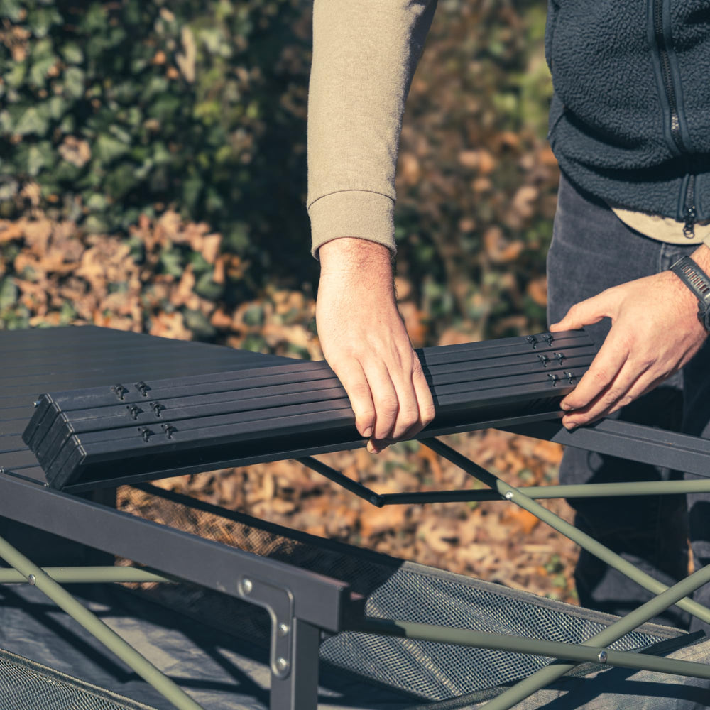 OUTSIDER roll-top folding table folds flat for compact storage and transport.