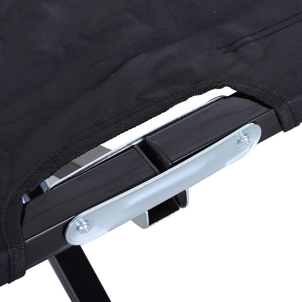 Outsunny black camping cot blends with outdoor gear