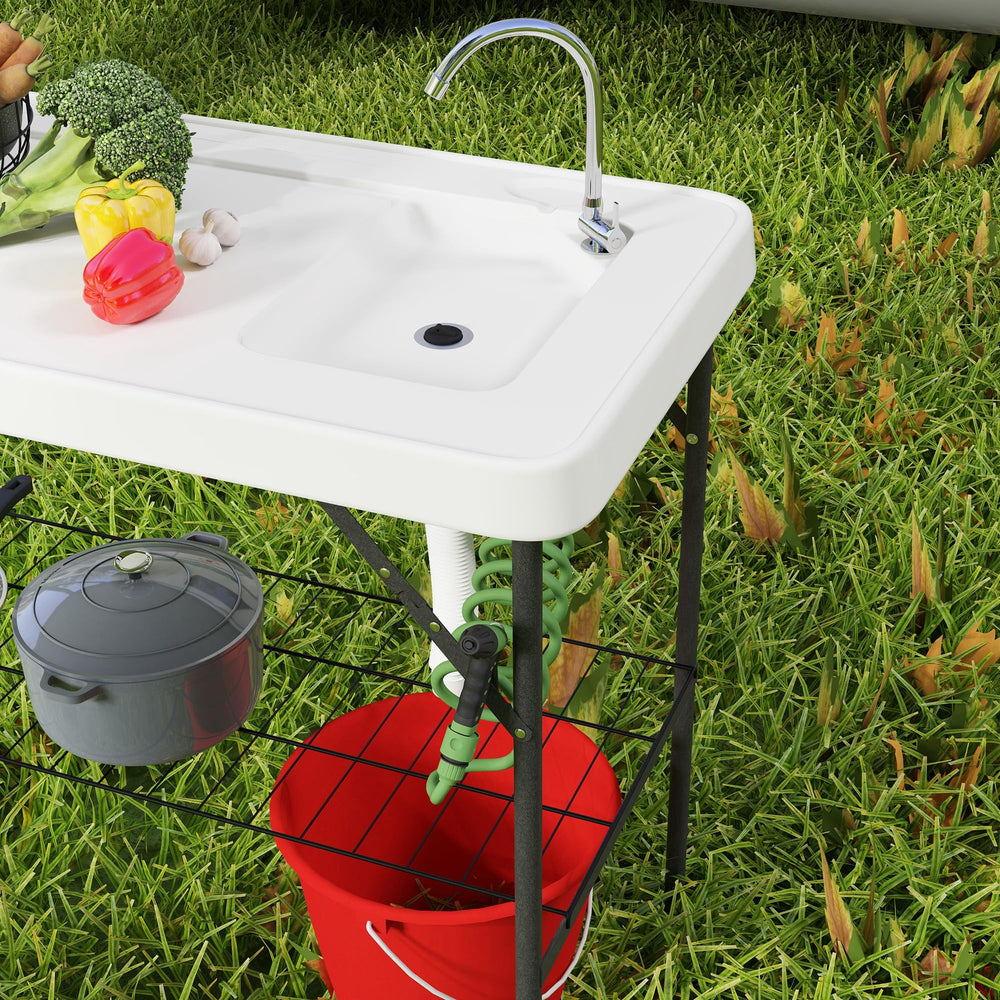 Outsunny outdoor filleting table with ample workspace at beach or camp