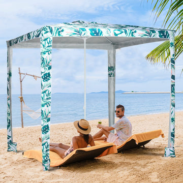 Outsunny green coconut palm cabana highlights four sandbags for stable seaside shelter.