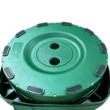 Outward Gear camouflage stool in use while camping, showcasing rugged outdoor convenience.