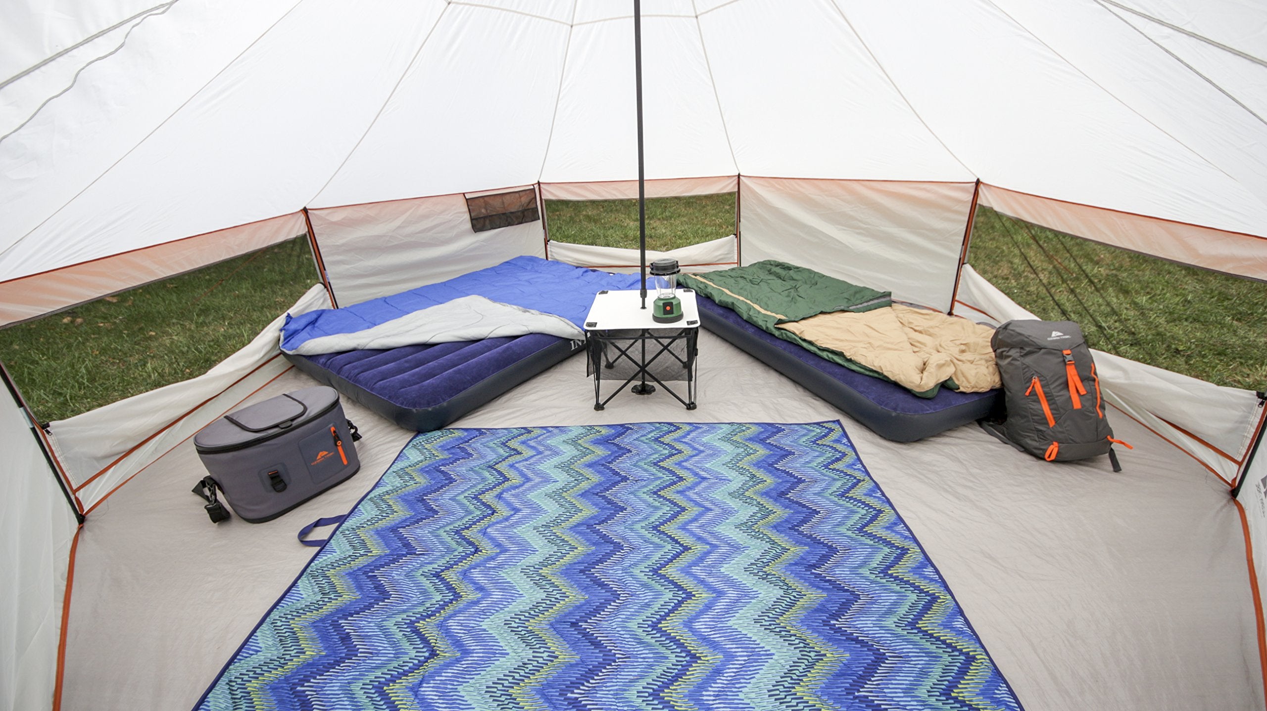 Ozark Trail yurt interior with center camp table for organization