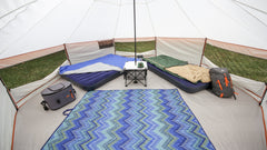 Ozark Trail yurt interior with center camp table for organization