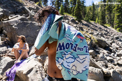 PackTowl Personal Flow Print folded compact demonstrates space-saving portability.