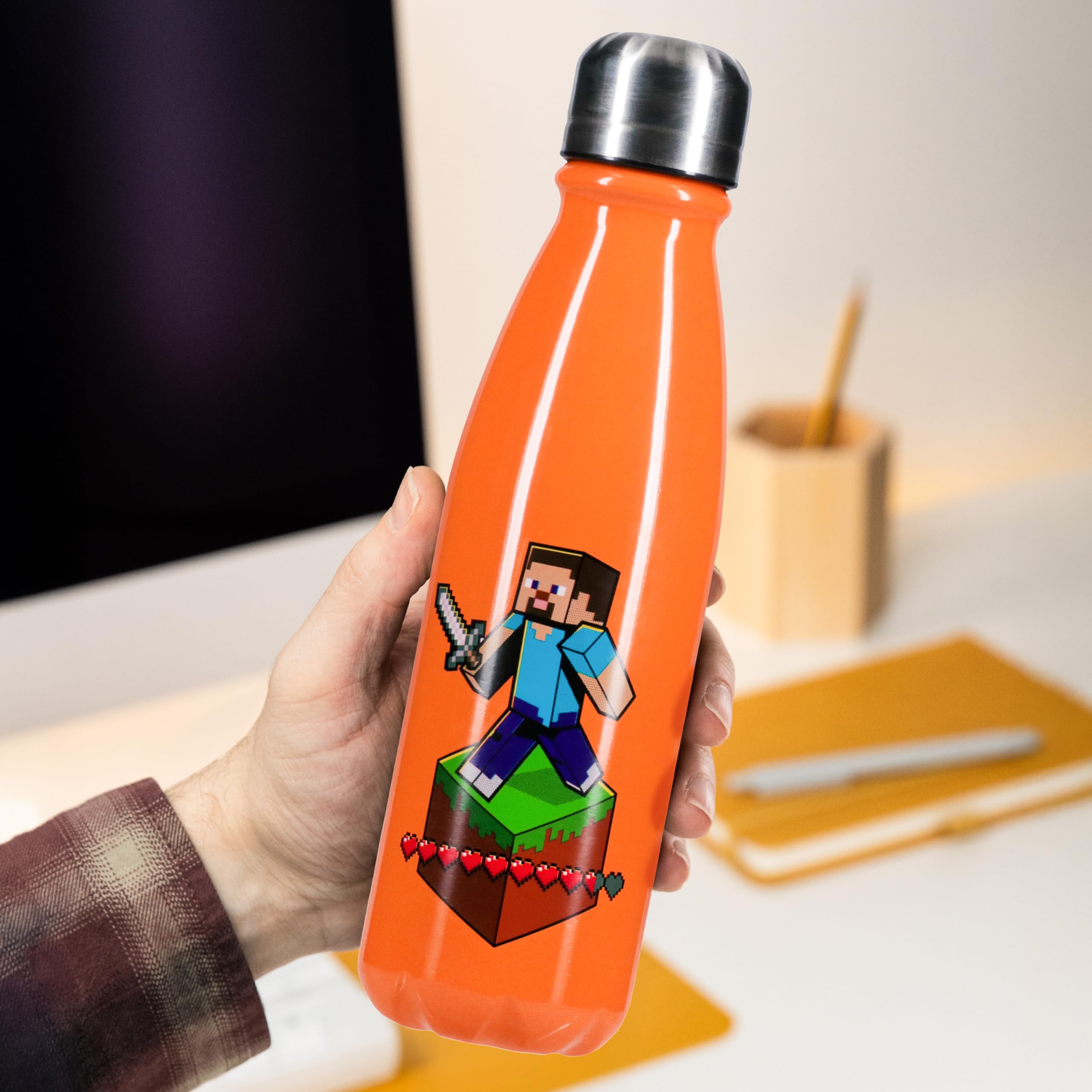 Paladone Minecraft water bottle on a desk for office use.