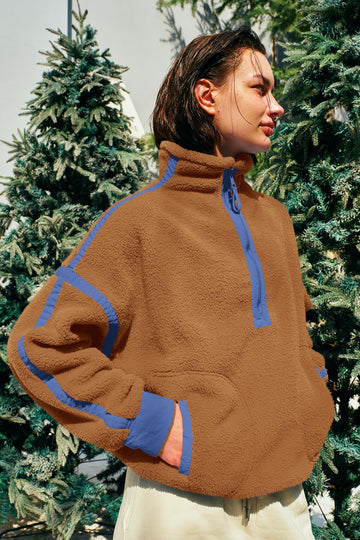 Panadila fleece pullover closeup of zip pockets and plush texture