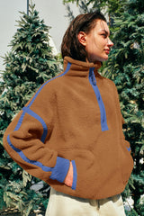 Panadila fleece pullover closeup of zip pockets and plush texture