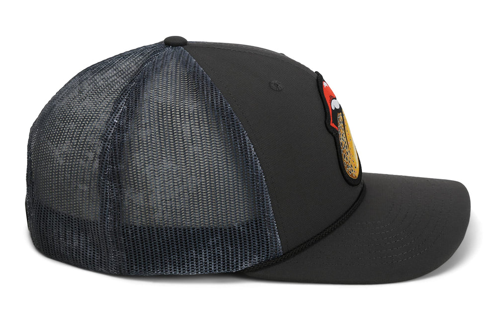 Paramount Outdoors black fly cap lifestyle shot, versatile headwear for anglers.