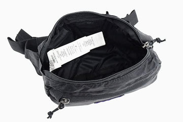 Patagonia Ultralight Black Hole Mini Hip Pack closeup durable fabric bold multicolour pattern