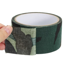 PATIKIL camouflage wrap being applied to equipment in the field