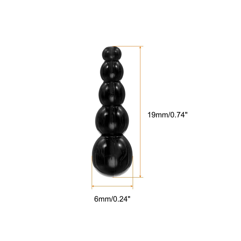 Close-up of black stacked fishing beads showing smooth hole