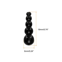 Close-up of black stacked fishing beads showing smooth hole