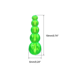 Close-up of green plastic fishing beads with smooth holes