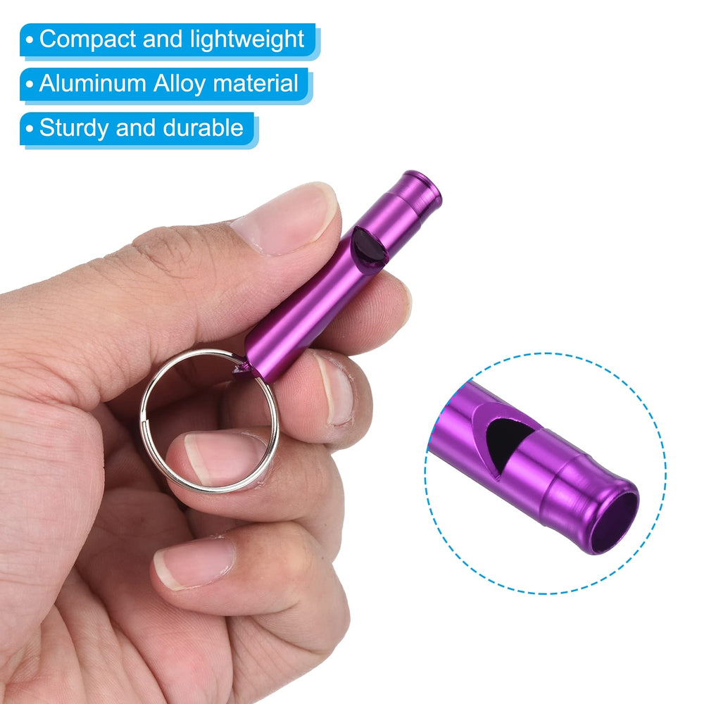 Whistle clipped to gear during hiking provides clear loud outdoors signaling.