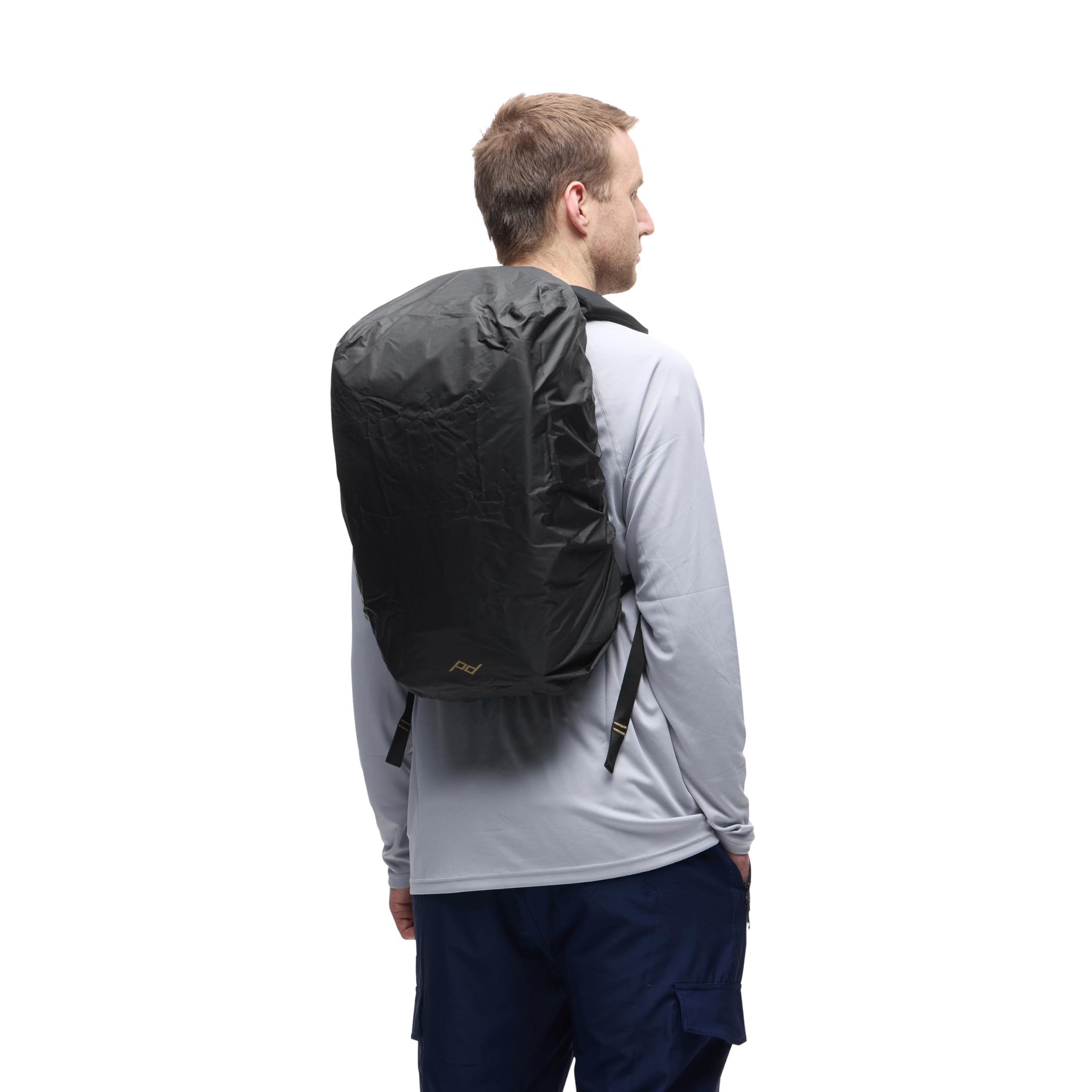 Peak Design Rain Fly fit 25-30L backpack demonstrates snug, secure coverage for mid-size packs