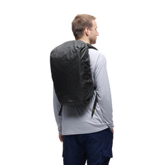 Peak Design Rain Fly fit 25-30L backpack demonstrates snug, secure coverage for mid-size packs