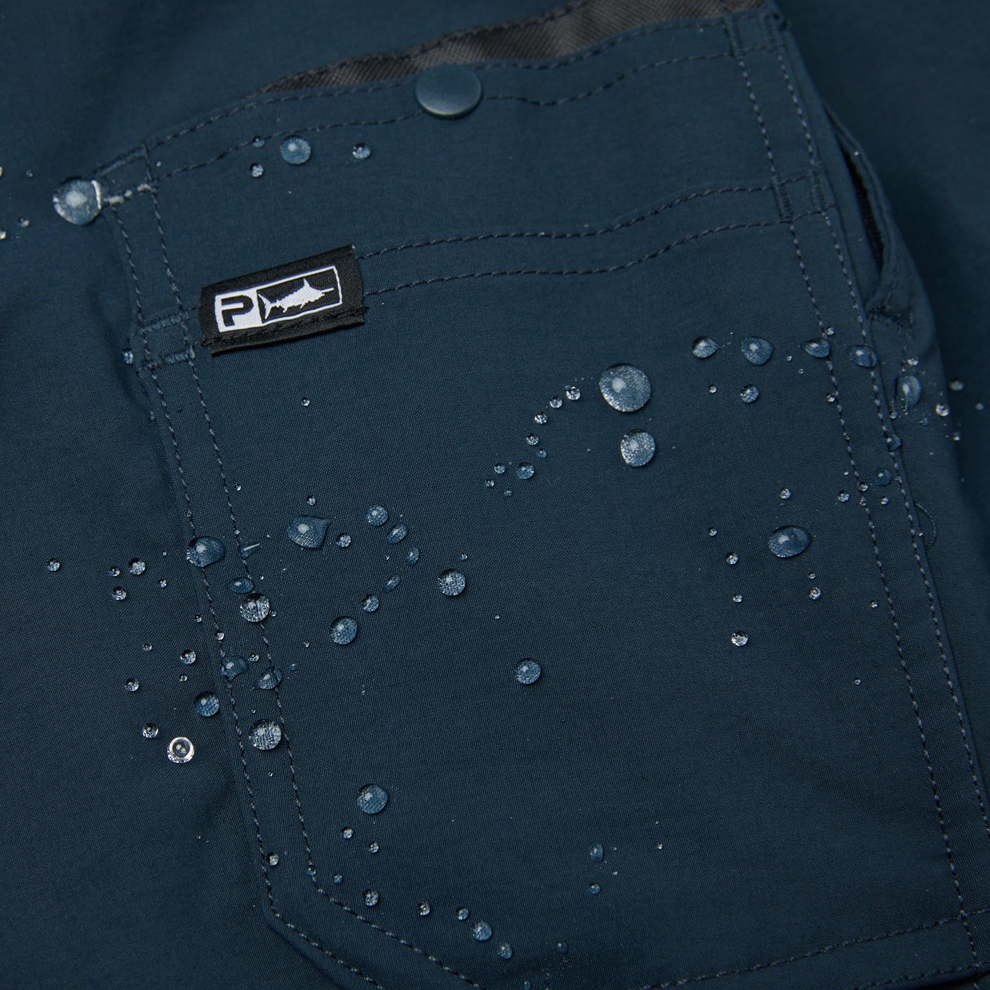 PELAGIC Palomar pants dual reinforced plier pockets in action for tough tasks