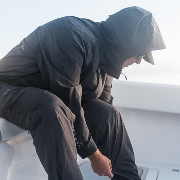 Pelagic Squall Pant Graphite back view showing durable fabric and fit in rain.