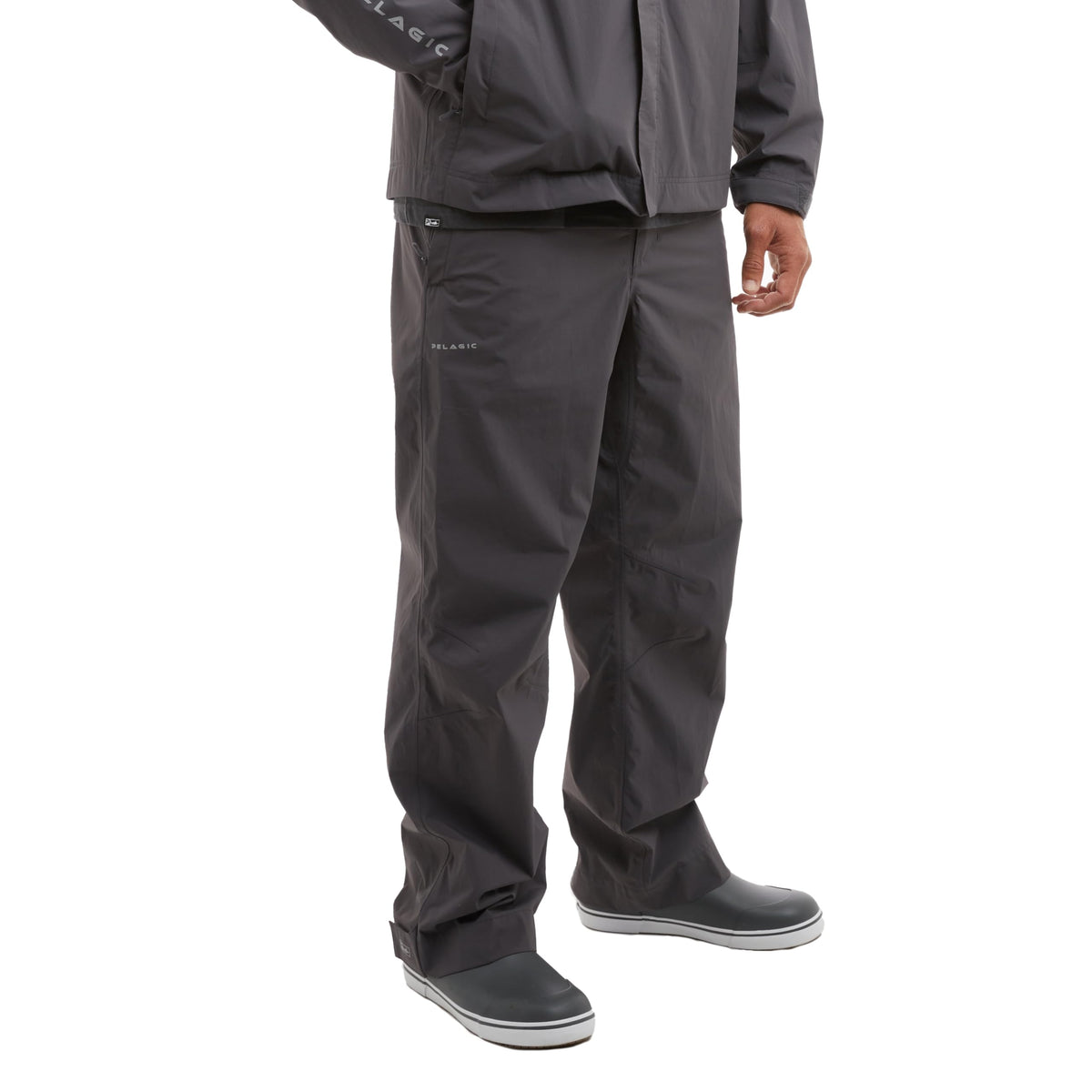 Pelagic Squall pant graphite front view shows zip pockets for rain-ready storage.
