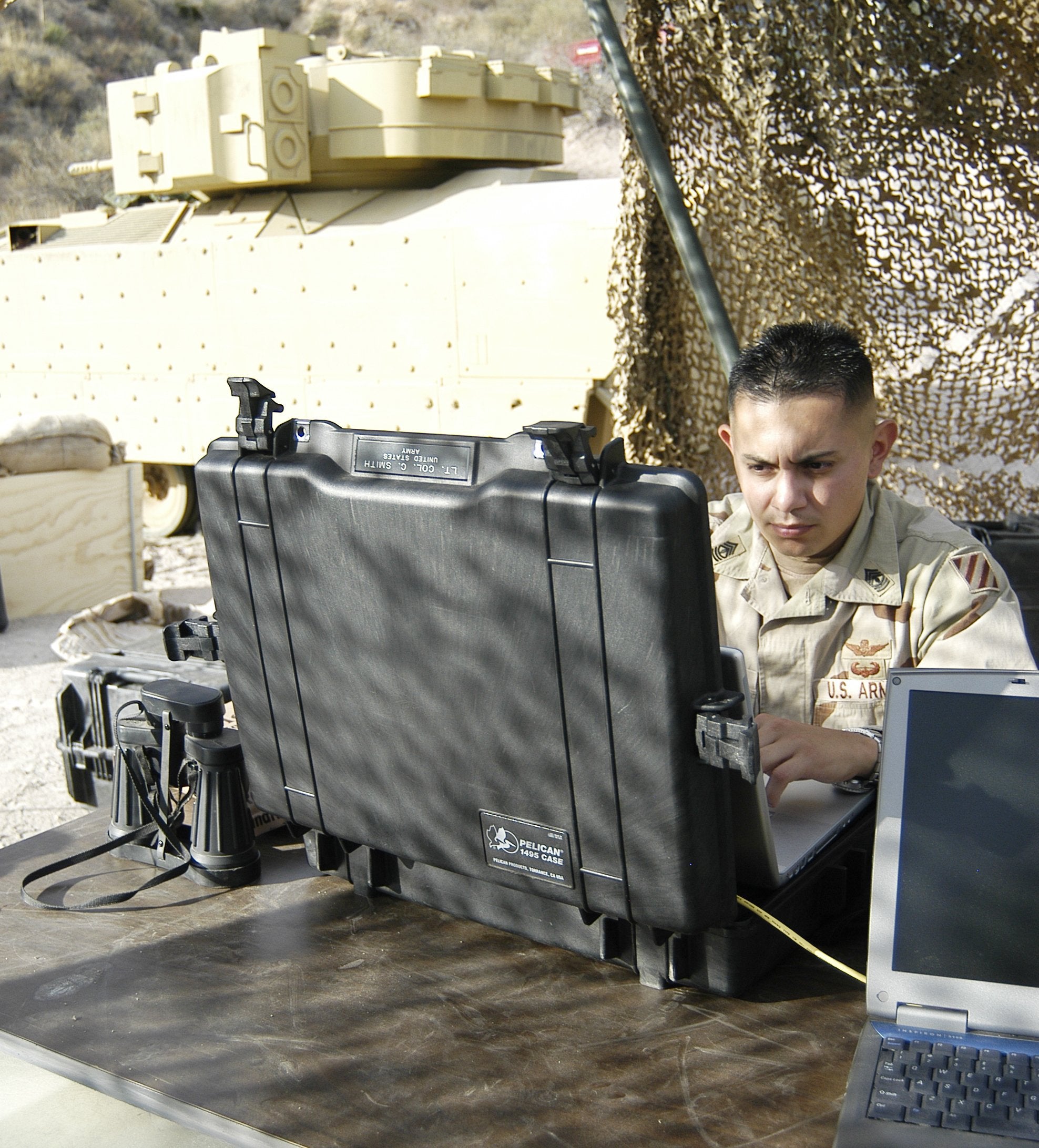 Pelican 1495 CC#1 with shock-absorbing tray protects laptop during transit.