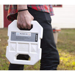 Pelican ice pack white, side view showcasing rugged shell and dual-handle design.