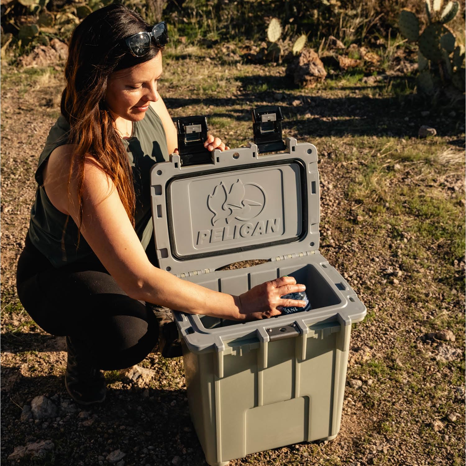 Pelican Elite 20qt cement-white tie-down slots for secure vehicle mounting.
