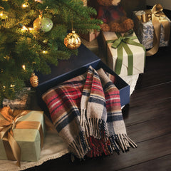 Pendleton wool blanket with leather carrier enables easy transport to picnics.