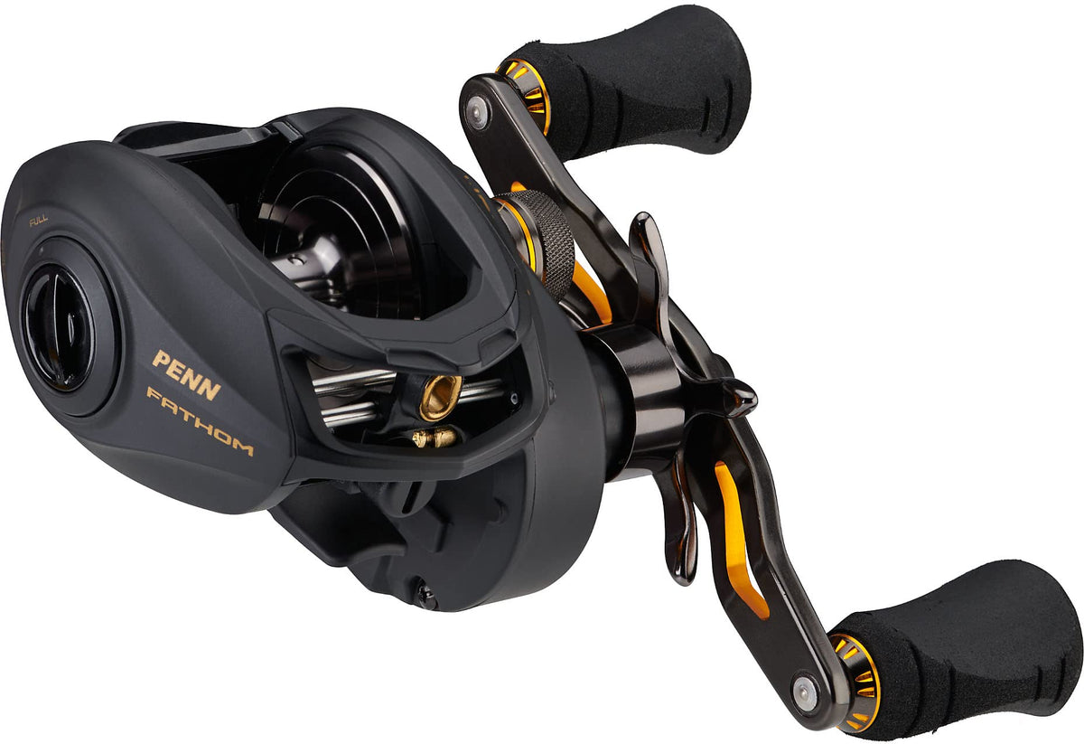 PENN Fathom low profile reel, black and gold, for smooth saltwater casting and reliable performance.