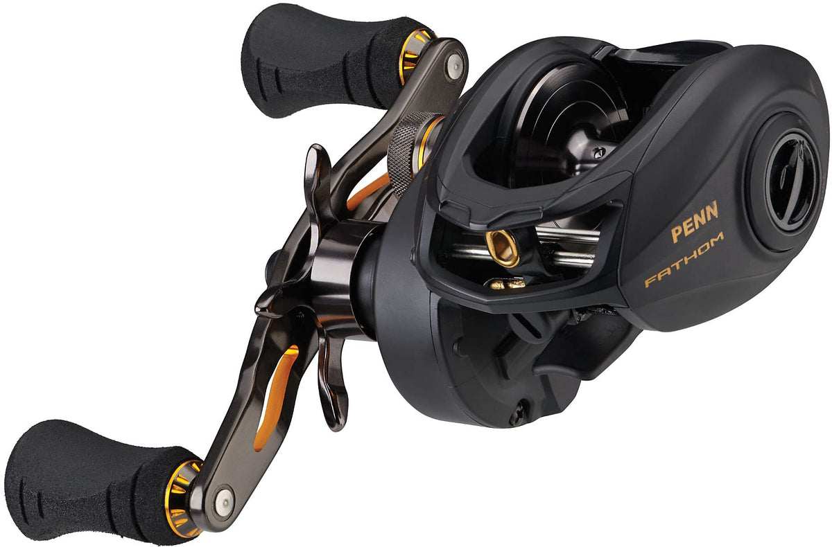 PENN Fathom low-profile reel in black and gold offers saltwater fishing performance.