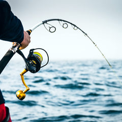 PENN Slammer IV close-up highlights brass CNC gearing for smooth retrieves.