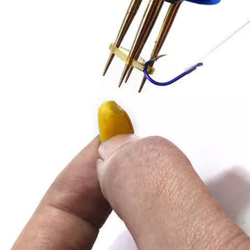 Peosaard Pellet Bander in use showing quick three-second bait attachment.