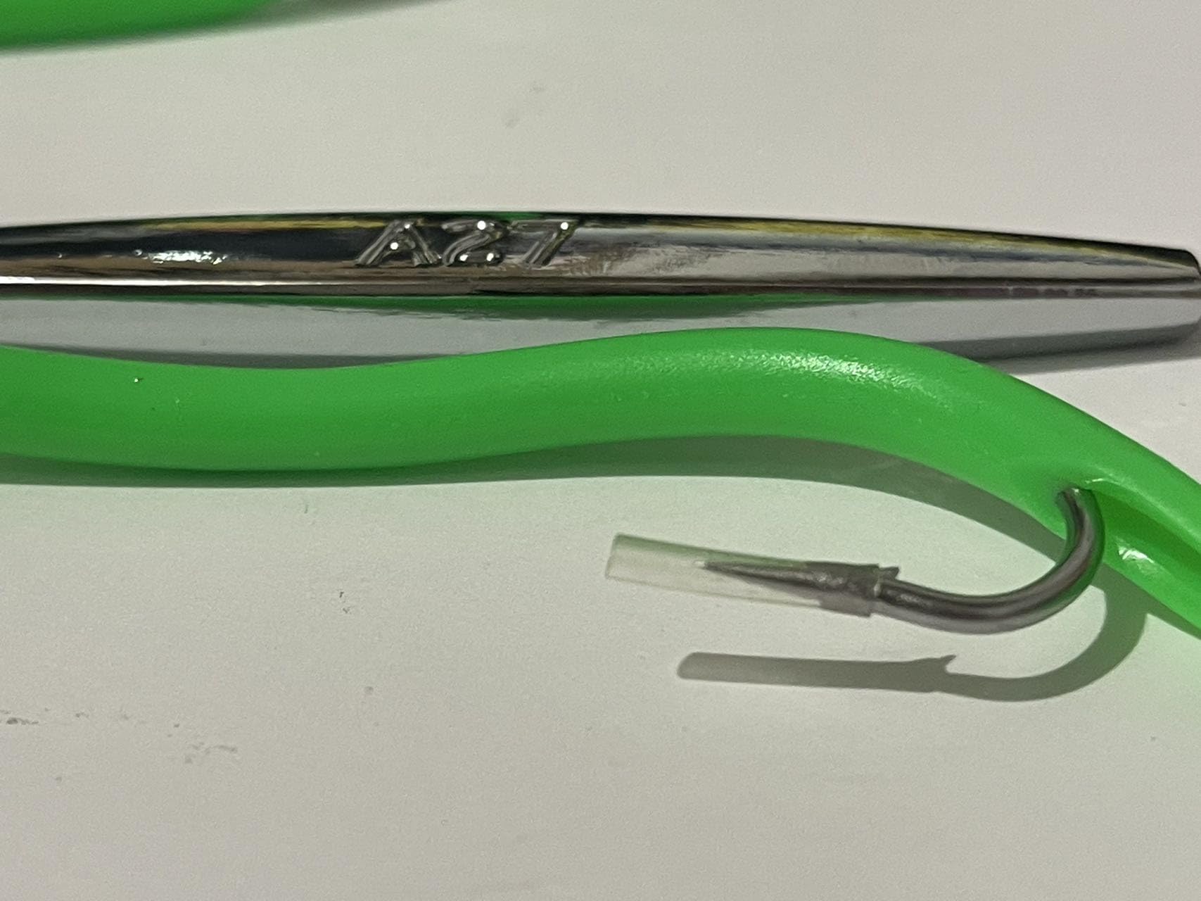 PESCALOX diamond jigs green 3oz chrome-plated body detail emphasizes lure shine.
