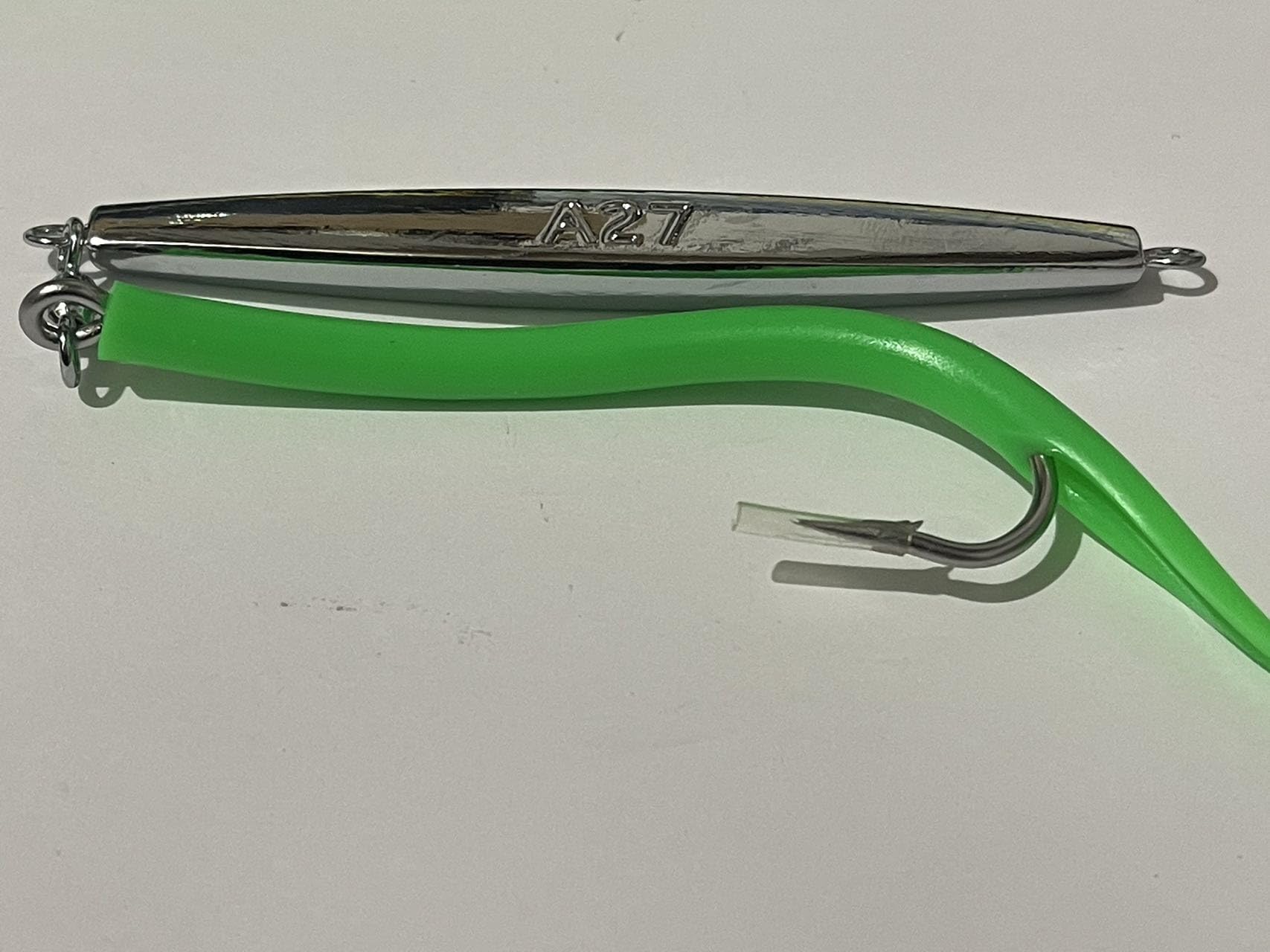 PESCALOX diamond jigs green 3oz hook closeup shows the 9/0 hook and rugged construction.