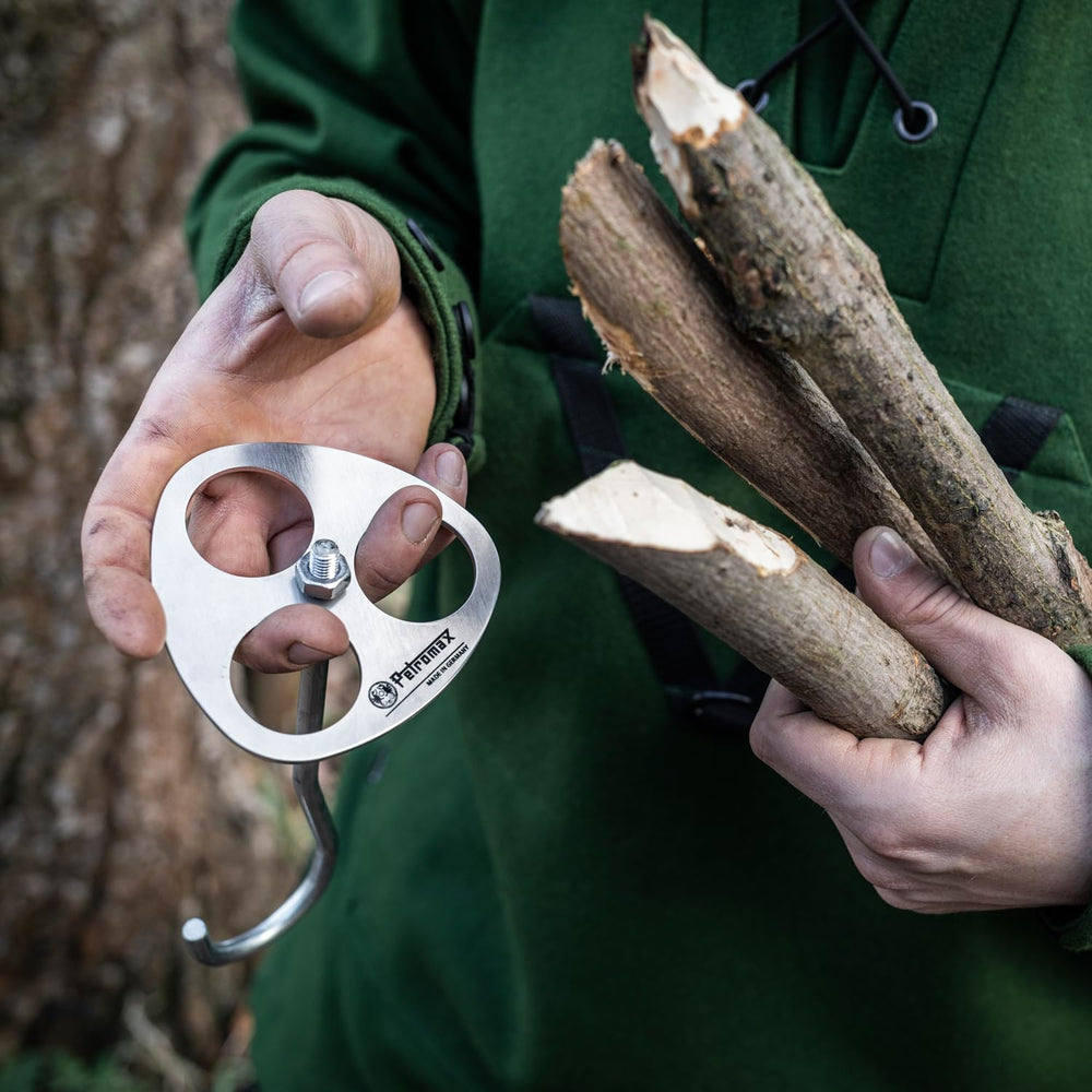 Petromax bushcraft tool aids independent outdoor cooking and shelter-building.