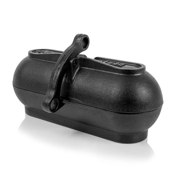 Petromax cast iron potato roaster over embers for even roasting of potatoes.