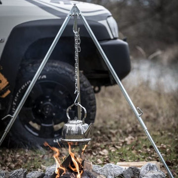 Petromax Dutch oven hanging setup for easy campfire cooking.