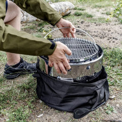 Petromax FT12 case with side pocket open for accessory storage.