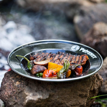 Petromax enamelware plate highlights lightweight design ideal for travel