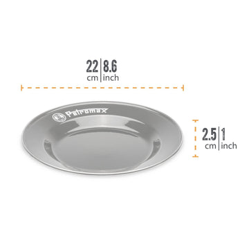 Petromax enamelware plate on a camping table with a black finish for outdoor meals